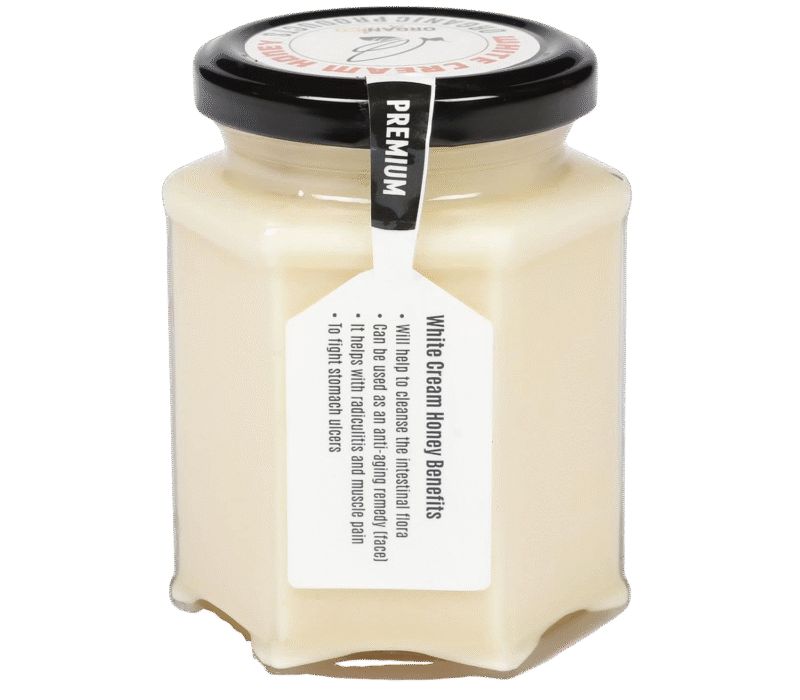 white honey in glass jar